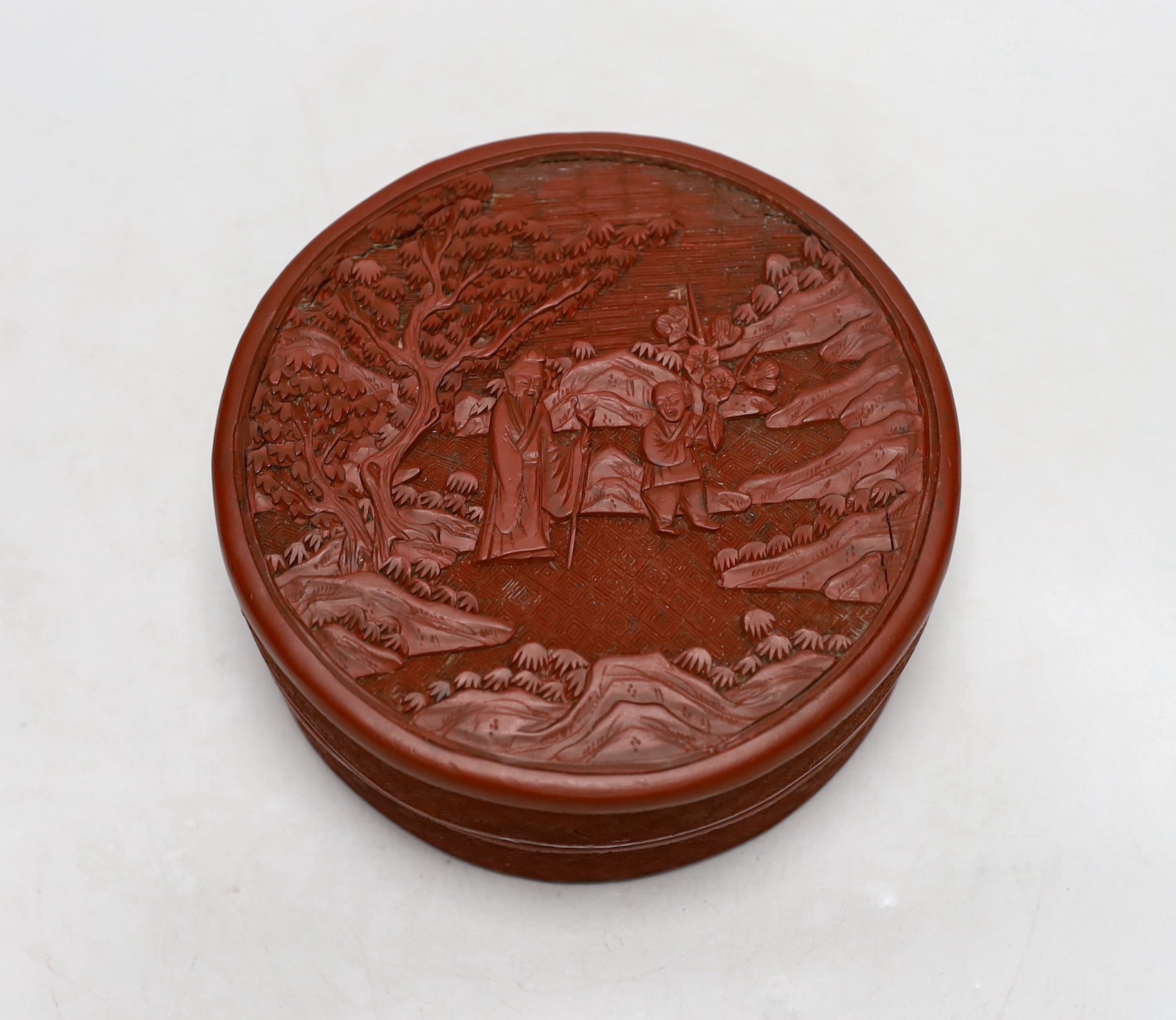 A 19th century Chinese cinnabar lacquer box and cover, 13cm diameter